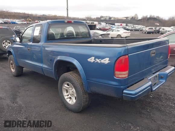 2003 Dodge Dakota Sport z VIN 1D7HG32NX3S322085, wystawiony jako IAAI lot #41780125 z przebiegiem 95 321 mil mil oraz . Historia ofert i sprzedaży dostępna na DreamBid. Obrazek 3.