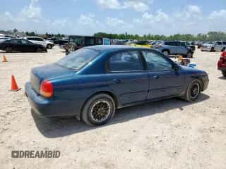 ✅ 1999 Hyundai Sonata • VIN: KMHWF25S4XA083933 • Лот: 61742525. Размещён на Copart с пробегом 84 425 миль миль. Получите бесплатный доступ к архиву аукционных продаж из США и посмотрите подробный отчёт об истории автомобиля на DreamBid. Изображение 3.