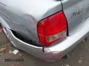 ✅ 2003 Mazda Protege DX • VIN: JM1BJ225330217847 • Лот: 43838287. Опубликован ранее на IAAI с пробегом 276 700 миль. Бесплатный доступ к архиву аукционных продаж из США и подробный отчёт об истории автомобиля на DreamBid. Изображение 6.