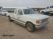 ✅ 1987 Ford F-150 • VIN: 1FTEX14N0HKB05912 • Lot: 71509695. Listed on Copart with 83,376 mi. Free auction sales archive from the USA and detailed vehicle history report at DreamBid. Image 4.