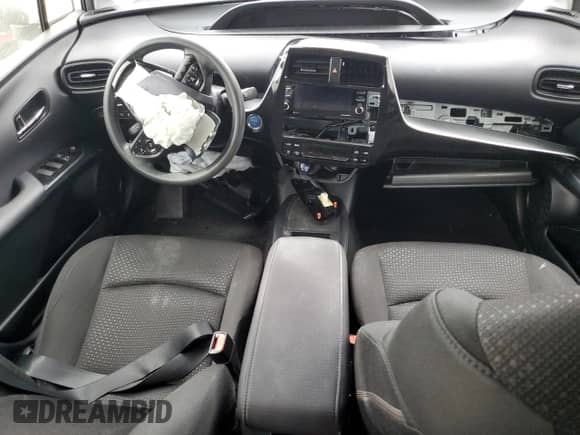 2022 Toyota Prius L Eco с VIN JTDKAMFUXN3175479, выставлен на аукционе Copart как лот 80868605 с пробегом Не указан миль и Списание • Salvage title. История ставок и продаж доступна на DreamBid. Изображение 8.