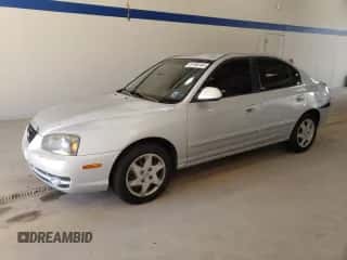 2004 Hyundai Elantra GLS z VIN KMHDN46D54U730968, wystawiony jako Copart lot #76198184 z przebiegiem 137 907 mil mil oraz Szkoda całkowita • Salvage title. Historia ofert i sprzedaży dostępna na DreamBid. Obrazek 1.