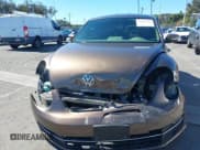 ✅ 2014 Volkswagen Beetle 2.0L TDI w/Sun/Sound/Nav • VIN: 3VWJL7AT1EM617082 • Лот: 43442124. Опубликован ранее на IAAI с пробегом 110 037 миль. Бесплатный доступ к архиву аукционных продаж из США и подробный отчёт об истории автомобиля на DreamBid. Изображение 13.