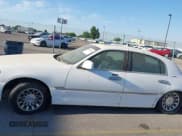 ✅ 2000 Lincoln Town Car Signature • VIN: 1LNHM82W3YY800310 • Lot: 42801252. Listed on IAAI with Not provided. Free auction sales archive from the USA and detailed vehicle history report at DreamBid. Image 6.