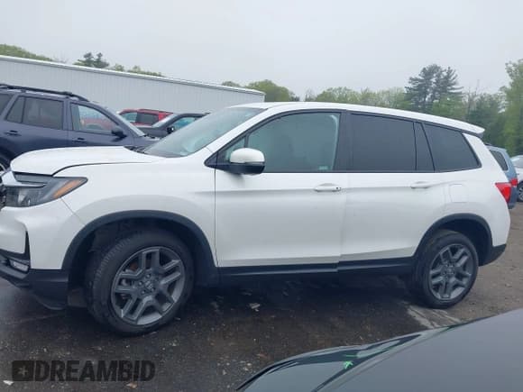 ✅ 2023 Honda Passport EX-L • VIN: 5FNYF8H5XPB005136 • Lot: 42275156. Listed on IAAI with 35,471 mi. Free auction sales archive from the USA and detailed vehicle history report at DreamBid. Image 14.