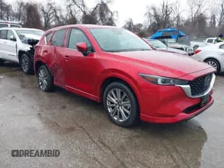 ✅ 2022 Mazda CX-5 Signature • VIN: JM3KFBXYXN0607777 • Lot: 41563918. Wystawiony na IAAI z przebiegiem 8 893 mil. Bezpłatny archiwum sprzedaży aukcyjnych z USA i szczegółowy raport historii pojazdu na DreamBid. Zdjęcie 1.