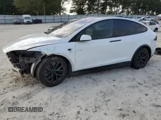 ✅ 2023 Tesla Model X • VIN: 7SAXCBE53PF369584 • Lot: 82320305. Wystawiony na Copart z przebiegiem 52 451 mil. Bezpłatny archiwum sprzedaży aukcyjnych z USA i szczegółowy raport historii pojazdu na DreamBid. Zdjęcie 1.