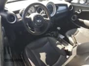 ✅ 2014 MINI Roadster • VIN: WMWSY1C50ET719556 • Lot: 65177525. Listed on Copart with 64,689 mi. Free auction sales archive from the USA and detailed vehicle history report at DreamBid. Image 8.