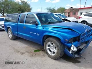 1999 Dodge Dakota Sport z VIN 1B7GL22Z3XS219482, wystawiony jako IAAI lot #42878061 z przebiegiem 166 860 mil mil oraz . Historia ofert i sprzedaży dostępna na DreamBid. Obrazek 1.