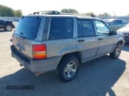 ✅ 1998 Jeep Grand Cherokee Laredo • VIN: 1J4FX58S9WC304258 • Lot: 43603048. Listed on IAAI with 232,555 mi. Free auction sales archive from the USA and detailed vehicle history report at DreamBid. Image 4.