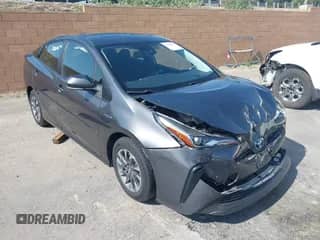 2021 Toyota Prius L Eco with VIN JTDKAMFU4M3144985, listed as a IAAI auction lot 42443957 with 20,816 mi miles and . Bid and sale history available at DreamBid. Image 1.