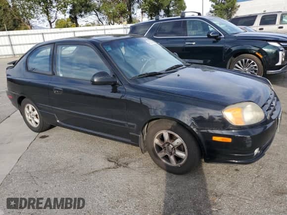 2005 Hyundai Accent GLS с VIN KMHCG35C35U364132, выставлен на аукционе Copart как лот 47227385 с пробегом 177 143 миль миль и Списание • Salvage title. История ставок и продаж доступна на DreamBid. Изображение 4.