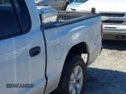 ✅ 2004 Dodge Dakota SLT • VIN: 1D7HL48K54S642754 • Lot: 41875084. Wystawiony na IAAI z przebiegiem 242 894 mil. Bezpłatny archiwum sprzedaży aukcyjnych z USA i szczegółowy raport historii pojazdu na DreamBid. Zdjęcie 6.