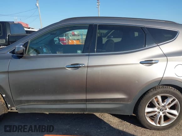✅ 2014 Hyundai Santa Fe • VIN: 5XYZW3LAXEG140795 • Лот: 43650491. Опубликован ранее на IAAI с пробегом 166 910 миль. Бесплатный доступ к архиву аукционных продаж из США и подробный отчёт об истории автомобиля на DreamBid. Изображение 14.