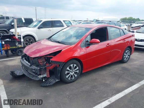 ✅ 2021 Toyota Prius LE • VIN: JTDL9MFU0M3029880 • Lot: 42450003. Listed on IAAI with 91,558 mi. Free auction sales archive from the USA and detailed vehicle history report at DreamBid. Image 2.