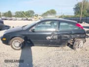 ✅ 2007 Ford Focus S • VIN: 1FAFP31N07W112697 • Lot: 43097246. Wystawiony na IAAI z przebiegiem 209 923 mil. Bezpłatny archiwum sprzedaży aukcyjnych z USA i szczegółowy raport historii pojazdu na DreamBid. Zdjęcie 14.