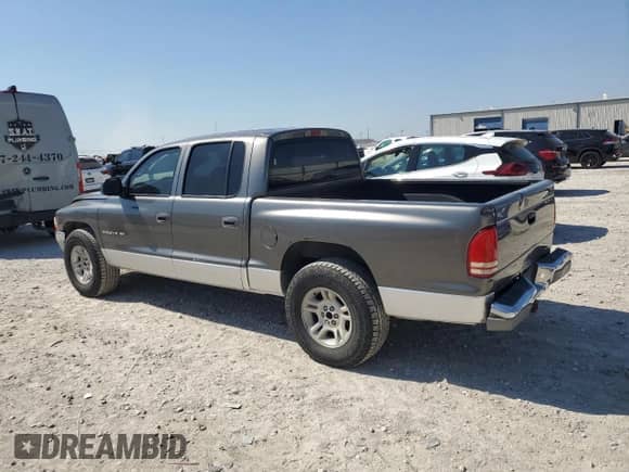 2001 Dodge Dakota Sport z VIN 1B7HL2AN61S301927, wystawiony jako Copart lot #74676094 z przebiegiem 228 616 mil mil oraz Szkoda całkowita • Salvage title. Historia ofert i sprzedaży dostępna na DreamBid. Obrazek 2.