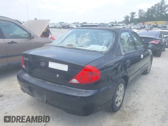 ✅ 2003 Kia Spectra • VIN: KNAFB121535246949 • Lot: 42402307. Listed on IAAI with 98,678 mi. Free auction sales archive from the USA and detailed vehicle history report at DreamBid. Image 4.