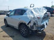 ✅ 2017 Mazda CX-5 Grand Touring • VIN: JM3KFBDL6H0220933 • Lot: 42739656. Wystawiony na IAAI z przebiegiem 82 211 mil. Bezpłatny archiwum sprzedaży aukcyjnych z USA i szczegółowy raport historii pojazdu na DreamBid. Zdjęcie 3.