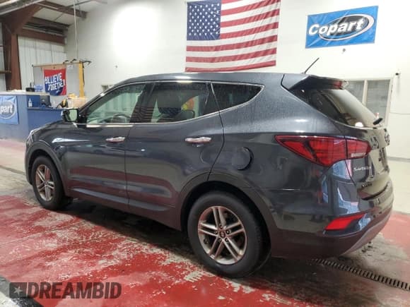 ✅ 2018 Hyundai Santa Fe 2.4L • VIN: 5XYZT3LB7JG560882 • Лот: 90848945. Опубликован ранее на Copart с пробегом 134 050 миль. Бесплатный доступ к архиву аукционных продаж из США и подробный отчёт об истории автомобиля на DreamBid. Изображение 2.