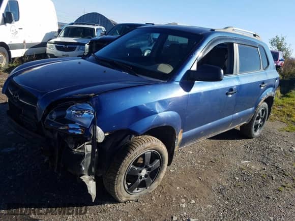 2006 Hyundai Tucson GL z VIN KM8JM72B76U405771, wystawiony jako Copart lot #76751074 z przebiegiem 233 649 mil mil oraz Szkoda całkowita • Salvage title. Historia ofert i sprzedaży dostępna na DreamBid. Obrazek 1.