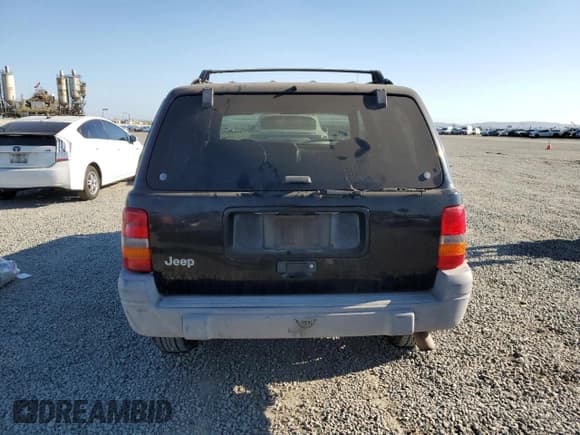 ✅ 1998 Jeep Grand Cherokee Laredo • VIN: 1J4FX58S6WC294787 • Лот: 71563695. Опубликован ранее на Copart с пробегом 198 537 миль. Бесплатный доступ к архиву аукционных продаж из США и подробный отчёт об истории автомобиля на DreamBid. Изображение 6.