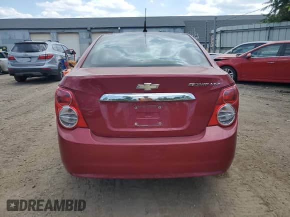 2012 Chevrolet Sonic LTZ with VIN 1G1JE5SH5C4152268, listed as a Copart auction lot 61047295 with 137,502 mi miles and Salvage title. Bid and sale history available at DreamBid. Image 6.