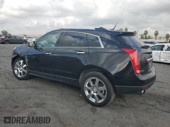 ✅ 2012 Cadillac SRX Performance Collection • VIN: 3GYFNBE31CS577198 • Lot: 81932555. Listed on Copart with 194,810 mi. Free auction sales archive from the USA and detailed vehicle history report at DreamBid. Image 2.