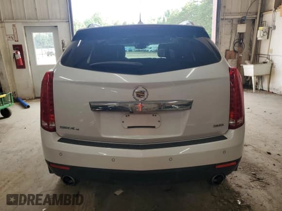 ✅ 2016 Cadillac SRX Premium Collection • VIN: 3GYFNDE34GS552894 • Lot: 64945985. Listed on Copart with 105,751 mi. Free auction sales archive from the USA and detailed vehicle history report at DreamBid. Image 6.