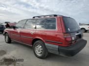 ✅ 1988 Toyota Camry • VIN: JT2SV21W9J0191632 • Lot: 82323554. Wystawiony na Copart z przebiegiem 145 961 mil. Bezpłatny archiwum sprzedaży aukcyjnych z USA i szczegółowy raport historii pojazdu na DreamBid. Zdjęcie 2.