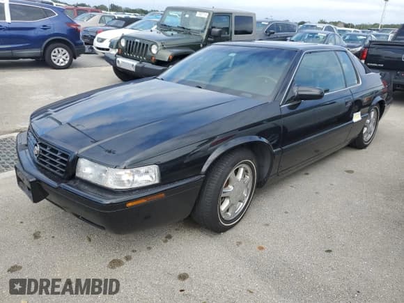 ✅ 2002 Cadillac Eldorado Touring • VIN: 1G6ET12912B102383 • Лот: 75119604. Опубликован ранее на Copart с пробегом Не указан. Бесплатный доступ к архиву аукционных продаж из США и подробный отчёт об истории автомобиля на DreamBid. Изображение 1.