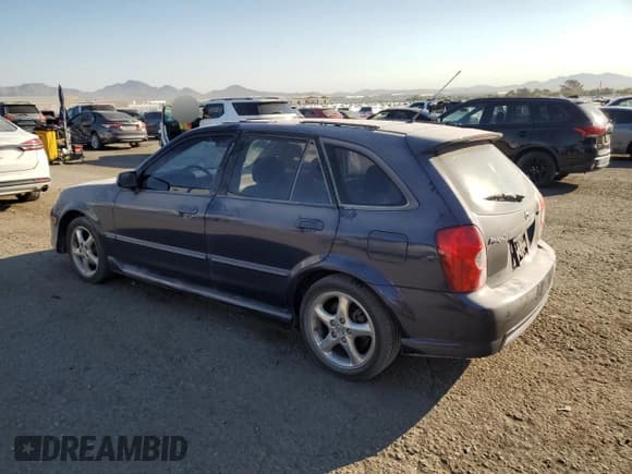 ✅ 2002 Mazda Protege • VIN: JM1BJ245921501313 • Lot: 74797214. Wystawiony na Copart z przebiegiem 241 536 mil. Bezpłatny archiwum sprzedaży aukcyjnych z USA i szczegółowy raport historii pojazdu na DreamBid. Zdjęcie 2.