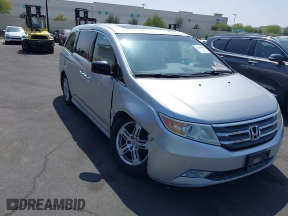 ✅ 2012 Honda Odyssey Touring • VIN: 5FNRL5H91CB004546 • Lot: 42175002. Listed on IAAI with 118,719 mi. Free auction sales archive from the USA and detailed vehicle history report at DreamBid. Image 1.