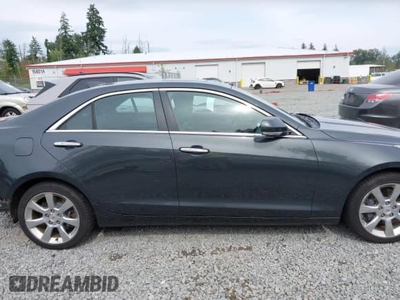 ✅ 2015 Cadillac ATS Performance AWD • VIN: 1G6AJ5SX0F0113158 • Лот: 42581763. Опубликован ранее на IAAI с пробегом 126 992 миль. Бесплатный доступ к архиву аукционных продаж из США и подробный отчёт об истории автомобиля на DreamBid. Изображение 14.