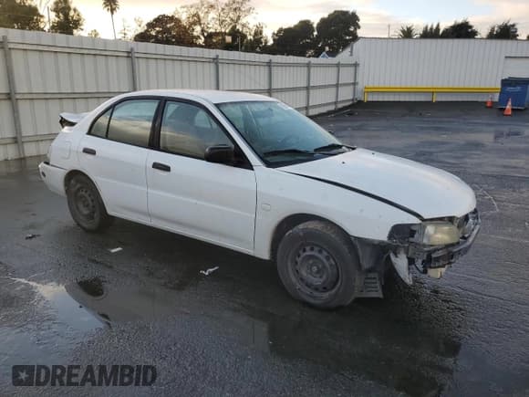 ✅ 2001 Mitsubishi Mirage ES • VIN: JA3AY26C71U036674 • Lot: 92950155. Listed on Copart with 282,890 mi. Free auction sales archive from the USA and detailed vehicle history report at DreamBid. Image 4.