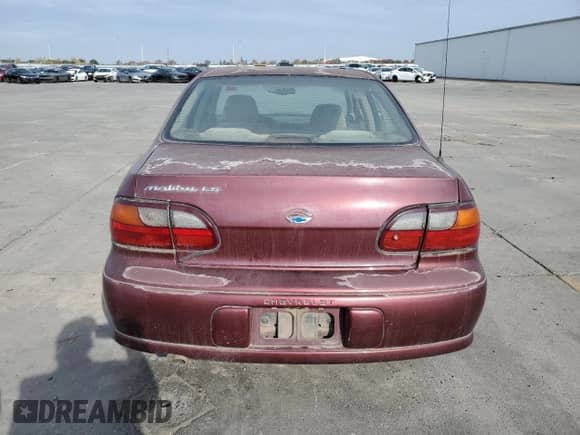 1998 Chevrolet Malibu LS z VIN 1G1NE52M0W6253001, wystawiony jako Copart lot #80629834 z przebiegiem Nie podano mil oraz Czysty tytuł • Clean title. Historia ofert i sprzedaży dostępna na DreamBid. Obrazek 6.