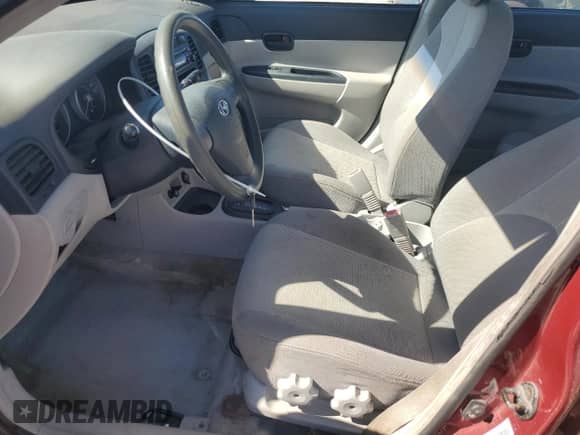 2006 Hyundai Accent GL z VIN KMHCN45C26U052459, wystawiony jako Copart lot #84417075 z przebiegiem 247 312 mil mil oraz Szkoda całkowita • Salvage title. Historia ofert i sprzedaży dostępna na DreamBid. Obrazek 7.