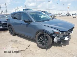 ✅ 2025 Mazda CX-5 S Carbon Edition • VIN: JM3KFBCM4S0679413 • Lot: 43019149. Listed on IAAI with 4,561 mi. Free auction sales archive from the USA and detailed vehicle history report at DreamBid. Image 1.