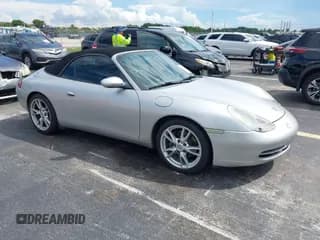 ✅ 1999 Porsche 911 • VIN: WP0CA2999XS656171 • Lot: 43280074. Listed on IAAI with 87,973 mi. Free auction sales archive from the USA and detailed vehicle history report at DreamBid. Image 1.