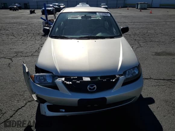 ✅ 2002 Mazda Protege DX • VIN: JM1BJ225921589573 • Lot: 82300865. Wystawiony na Copart z przebiegiem 108 594 mil. Bezpłatny archiwum sprzedaży aukcyjnych z USA i szczegółowy raport historii pojazdu na DreamBid. Zdjęcie 5.