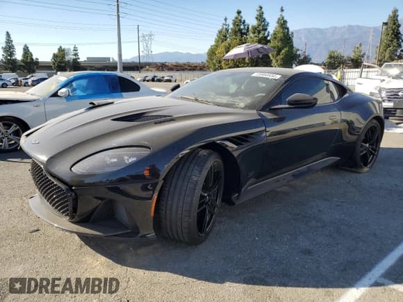 ✅ 2021 Aston Martin DBS Superleggera • VIN: SCFRMHAVXMGR02478 • Lot: 75864934. Listed on Copart with 10,145 mi. Free auction sales archive from the USA and detailed vehicle history report at DreamBid. Image 1.