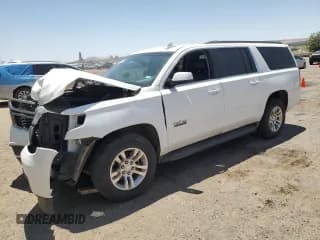✅ 2018 Chevrolet Suburban LT • VIN: 1GNSCHKC8JR137312 • Lot: 61098295. Listed on Copart with 104,561 mi. Free auction sales archive from the USA and detailed vehicle history report at DreamBid. Image 1.