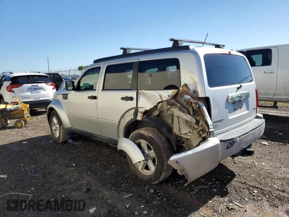 2007 Dodge Nitro SLT с VIN 1D8GU58K77W557115, выставлен на аукционе Copart как лот 81274294 с пробегом 152 529 миль миль и Списание • Salvage title. История ставок и продаж доступна на DreamBid. Изображение 2.