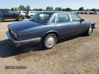 ✅ 1991 Jaguar XJ • VIN: SAJKL194XMC641707 • Лот: 63644904. Опубликован ранее на Copart с пробегом 163 027 миль. Бесплатный доступ к архиву аукционных продаж из США и подробный отчёт об истории автомобиля на DreamBid. Изображение 3.