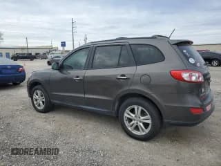 ✅ 2012 Hyundai Santa Fe Limited • VIN: 5XYZK4AG1CG156812 • Lot: 87953285. Listed on Copart with 186,428 mi. Free auction sales archive from the USA and detailed vehicle history report at DreamBid. Image 2.