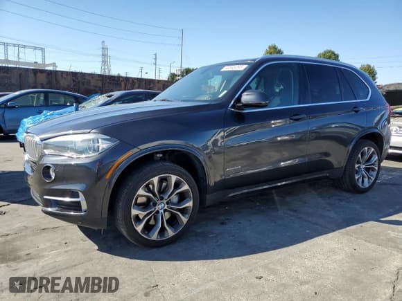 ✅ 2015 BMW X5 xDrive50i • VIN: 5UXKR6C54F0J77201 • Lot: 90848095. Listed on Copart with 131,670 mi. Free auction sales archive from the USA and detailed vehicle history report at DreamBid. Image 1.