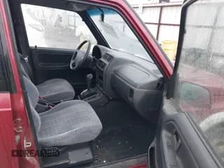 ✅ 1996 Suzuki Sidekick • VIN: JS3TD21V0T4107927 • Lot: 41249522. Listed on IAAI with 225,665 mi. Free auction sales archive from the USA and detailed vehicle history report at DreamBid. Image 5.