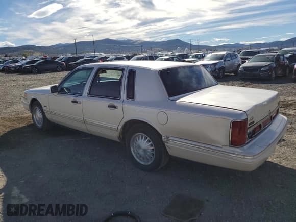 ✅ 1997 Lincoln Town Car Cartier • VIN: 1LNLM83W8VY738956 • Lot: 72179584. Listed on Copart with 167,987 mi. Free auction sales archive from the USA and detailed vehicle history report at DreamBid. Image 2.