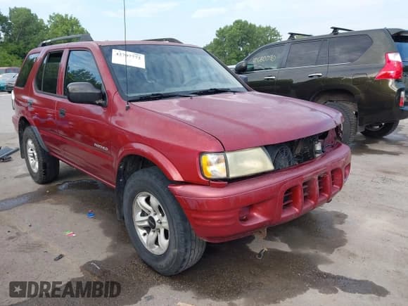 ✅ 2004 Isuzu Rodeo S • VIN: 4S2CK58Y444303591 • Lot: 42707772. Listed on IAAI with 156,792 mi. Free auction sales archive from the USA and detailed vehicle history report at DreamBid. Image 1.