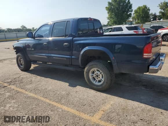 2000 Dodge Dakota Sport z VIN 1B7GG2AN8YS665678, wystawiony jako Copart lot #63878554 z przebiegiem 92 470 mil mil oraz Szkoda całkowita • Salvage title. Historia ofert i sprzedaży dostępna na DreamBid. Obrazek 2.